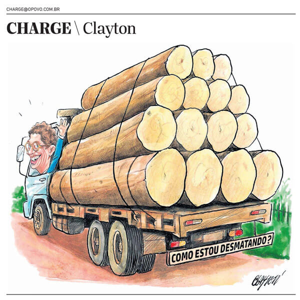 Ricardo Salles, então ministro do Meio Ambiente, acena da boleia de um caminhão carregado de grandes toras de madeira empilhadas na carroceria. No letreiro na parte de trás do caminhão, os dizeres perguntam: 'Como estou desmatando?'. Ele está na janela e sorri. Publicada em 27/5/2021.
